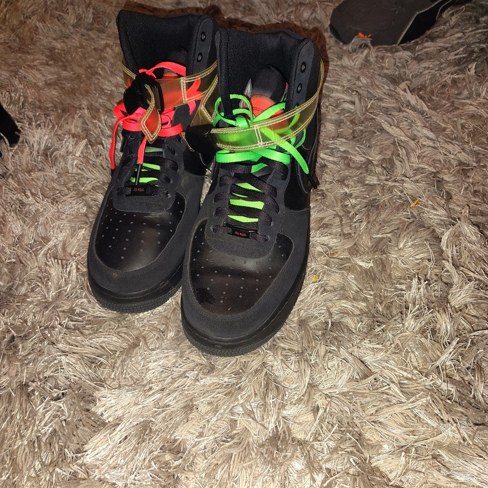 Dynamic Black Athletic Shoes with Red and Green Highlights